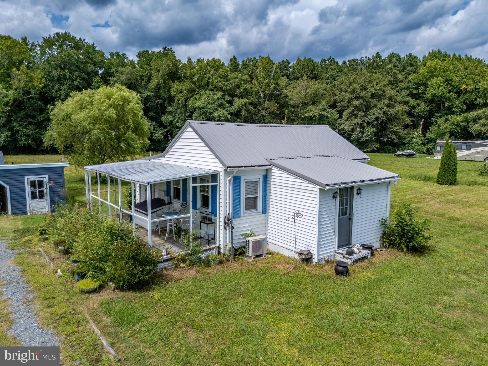 7821 Libertytown Road Berlin, MD 21811 - Photo 4 of 9 an aerial view of a house and garden