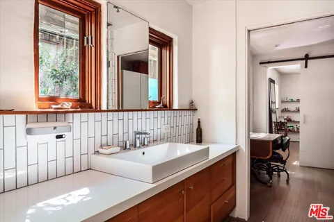 a bathroom with a sink and a mirror