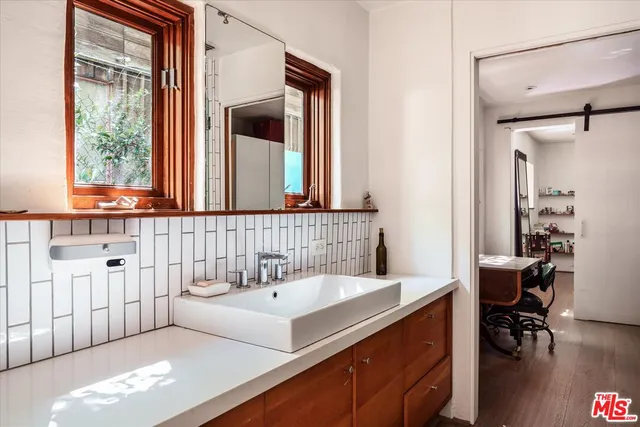 a bathroom with a sink and a mirror