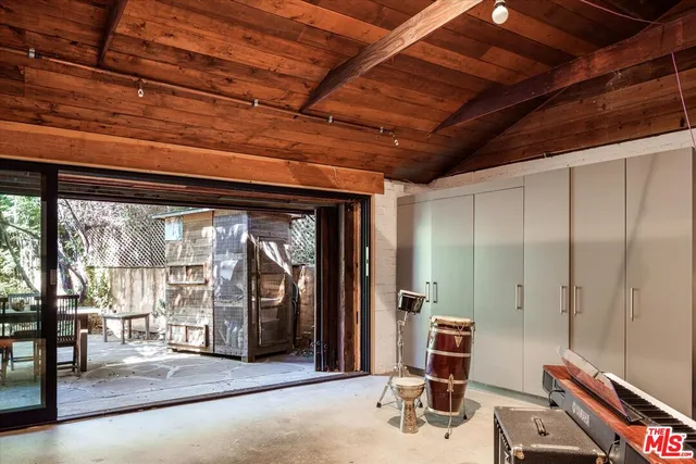 a room with gym equipment and a large window