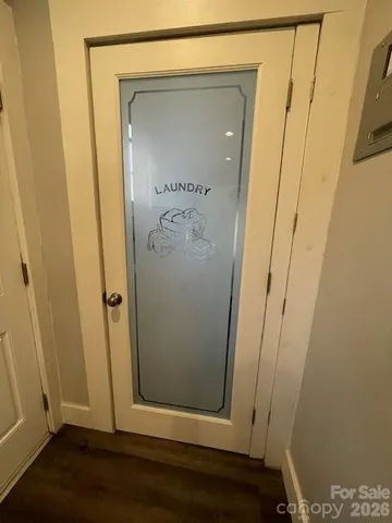 a view of front door with a mirror