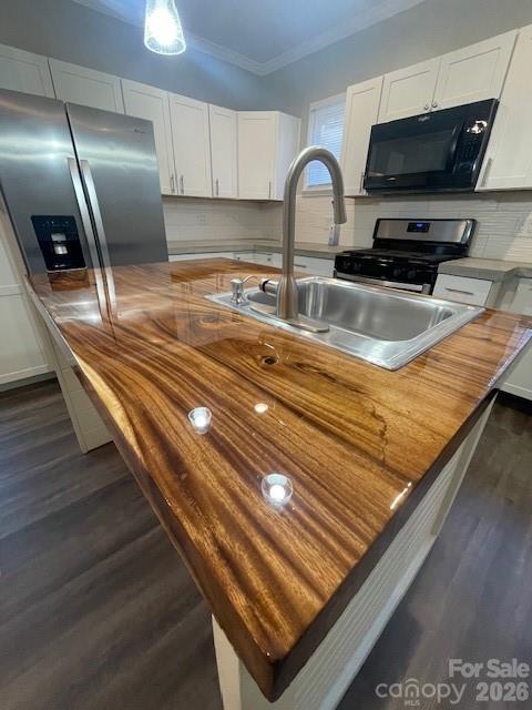 443 17th Street Cramerton, NC 28032 - Photo 7 of 20 a kitchen with stainless steel appliances granite countertop a sink a stove and a wooden floors
