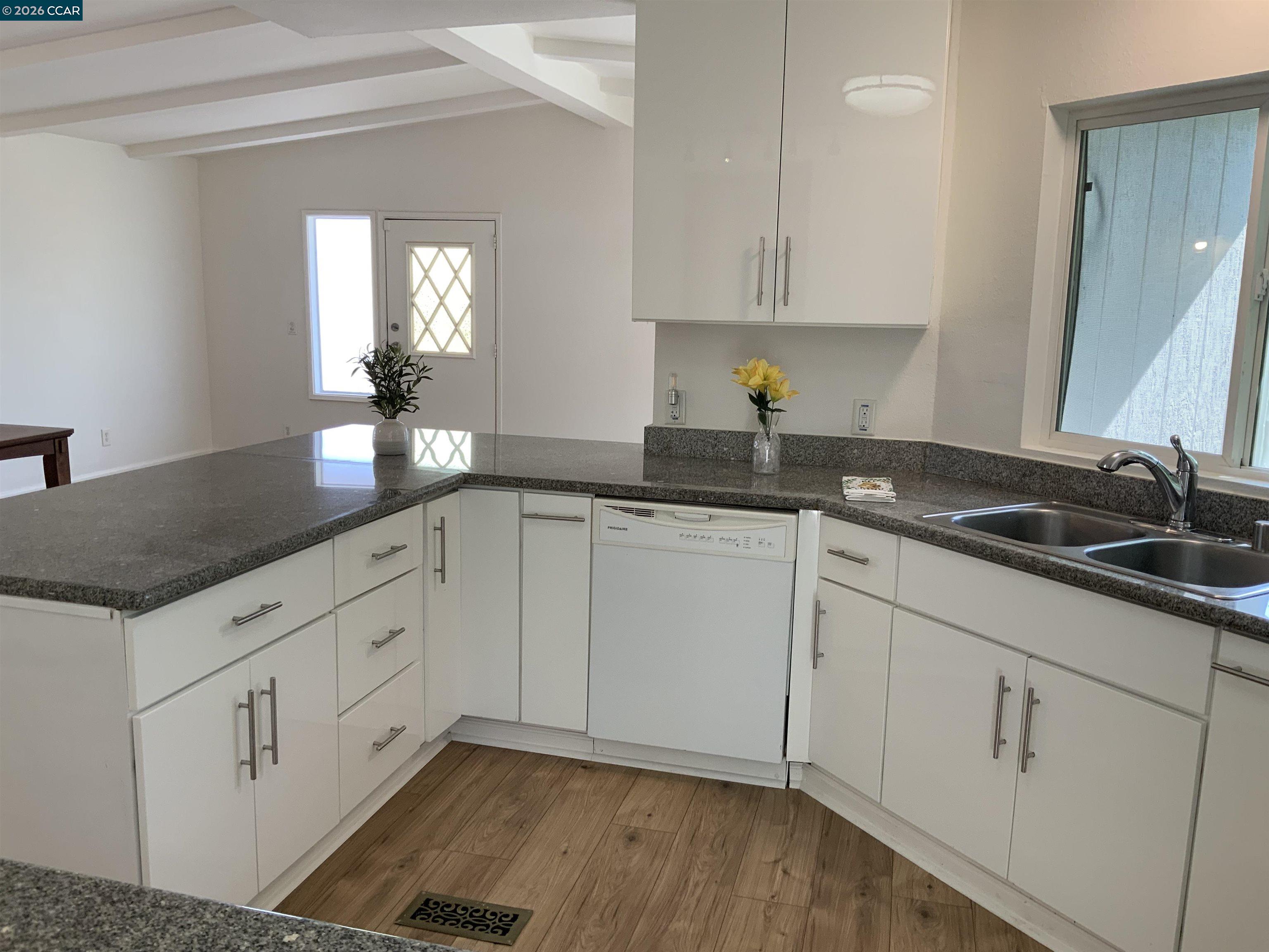140 Shannon Pittsburg, CA 94565 - Photo 12 of 37 a kitchen with granite countertop white cabinets and a sink