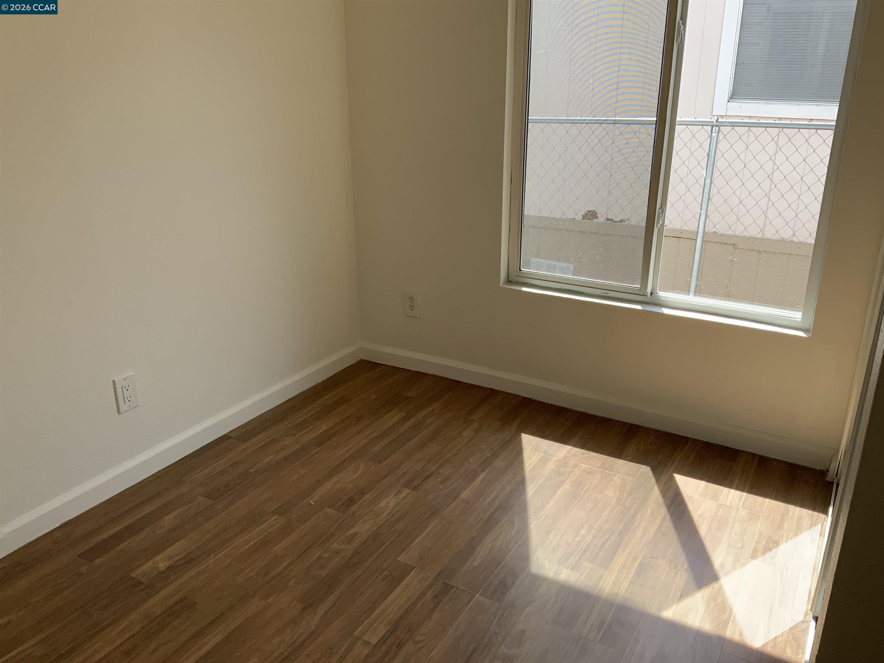 140 Shannon Pittsburg, CA 94565 - Photo 17 of 37 a view of a small space with wooden floor and a window