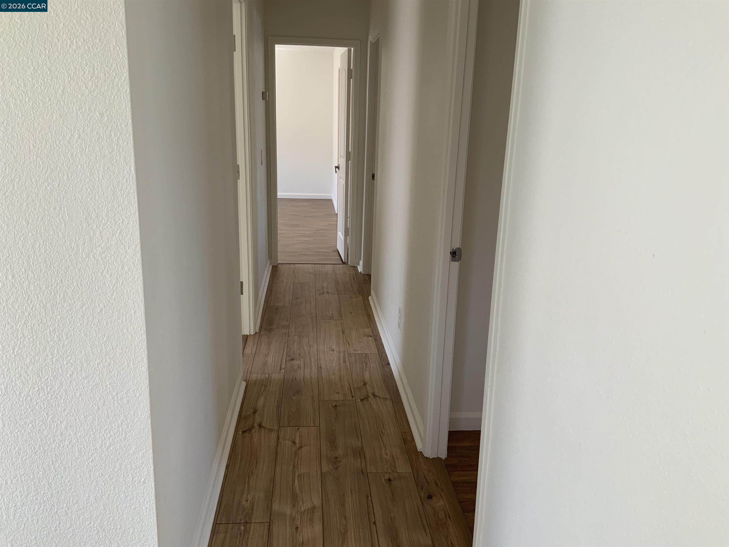 140 Shannon Pittsburg, CA 94565 - Photo 18 of 37 a view of a hallway with wooden floor