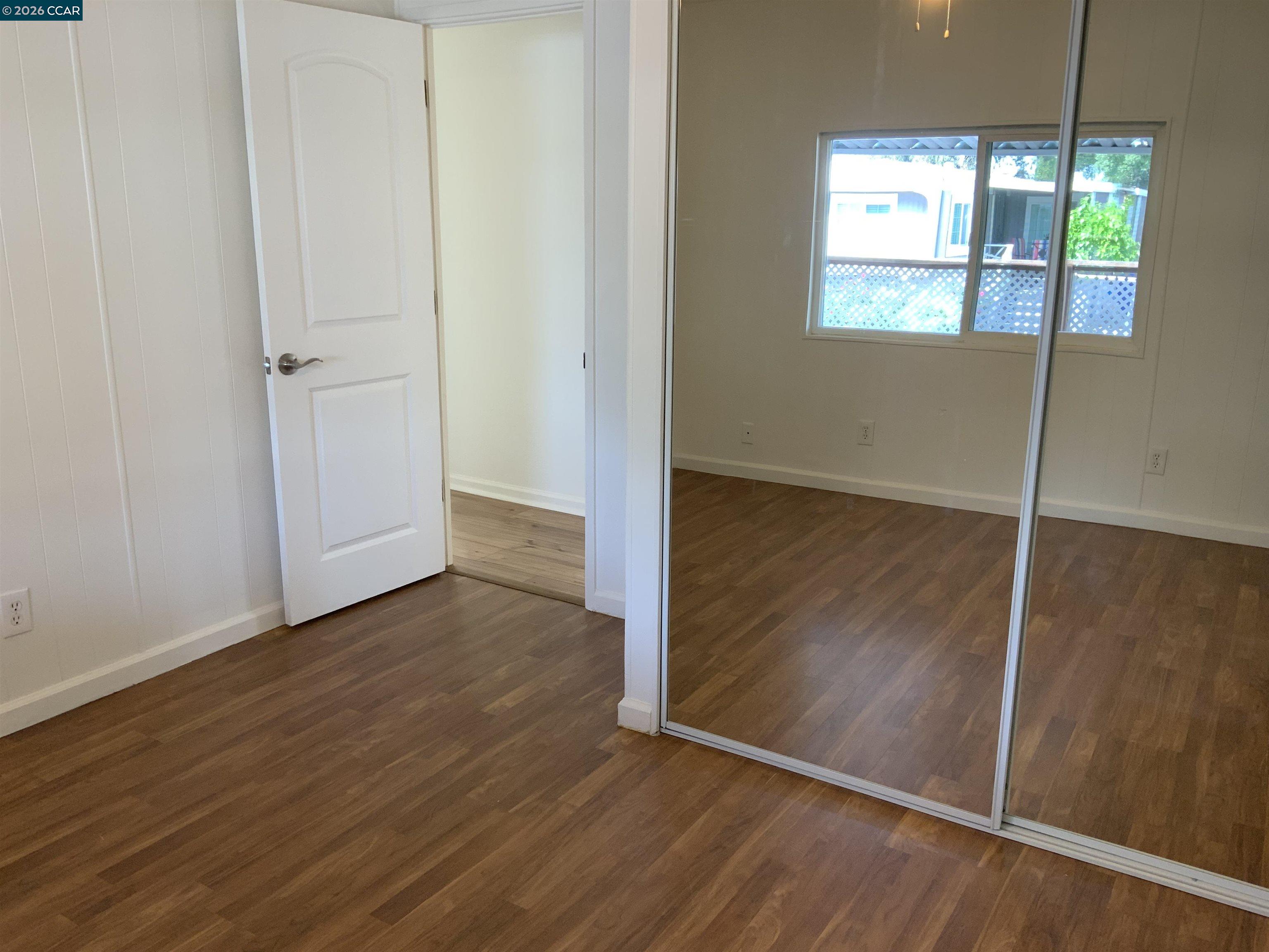 140 Shannon Pittsburg, CA 94565 - Photo 20 of 37 an empty room with wooden floor and windows
