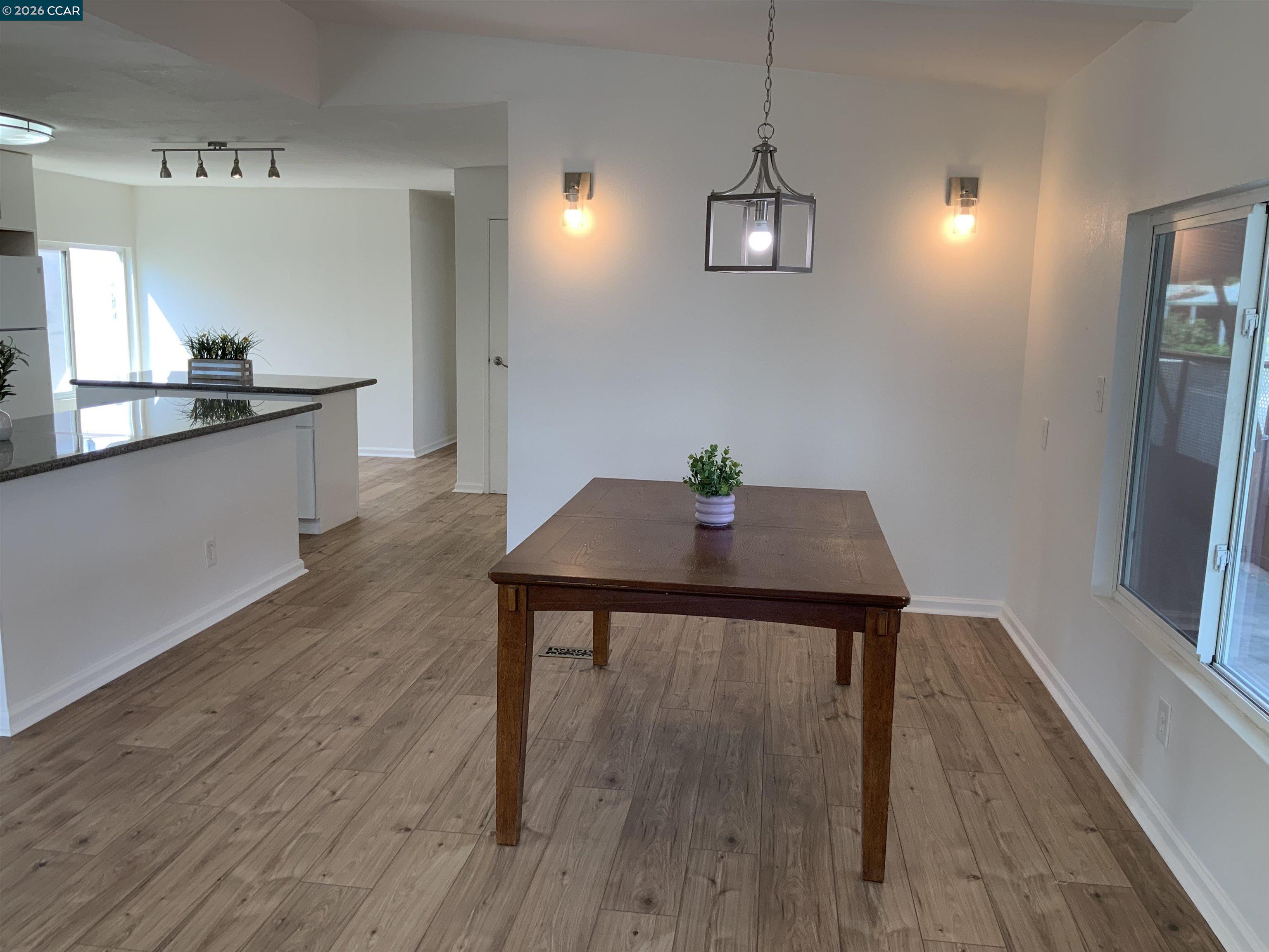 140 Shannon Pittsburg, CA 94565 - Photo 6 of 37 a view of a dining room with furniture and wooden floor