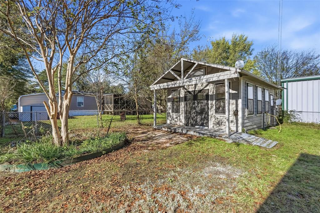 9938 John Flowers Road Wills Point, TX 75169 - Photo 36 of 40 View of yard featuring an outdoor structure