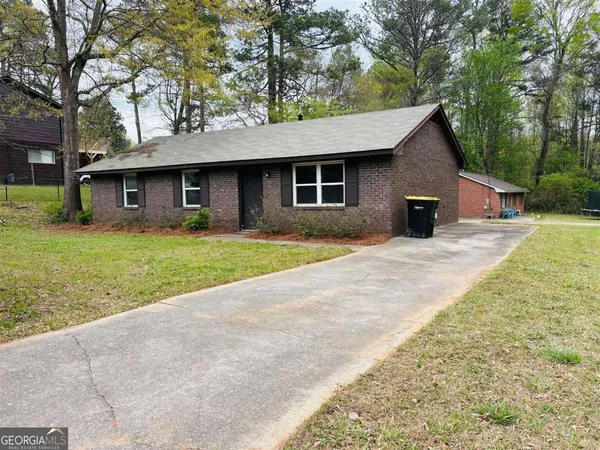 a front view of a house with yard