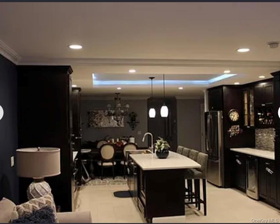 78-45 79th Place Queens, NY 11385 - Photo 11 of 36 a bathroom with a sink a toilet and a mirror