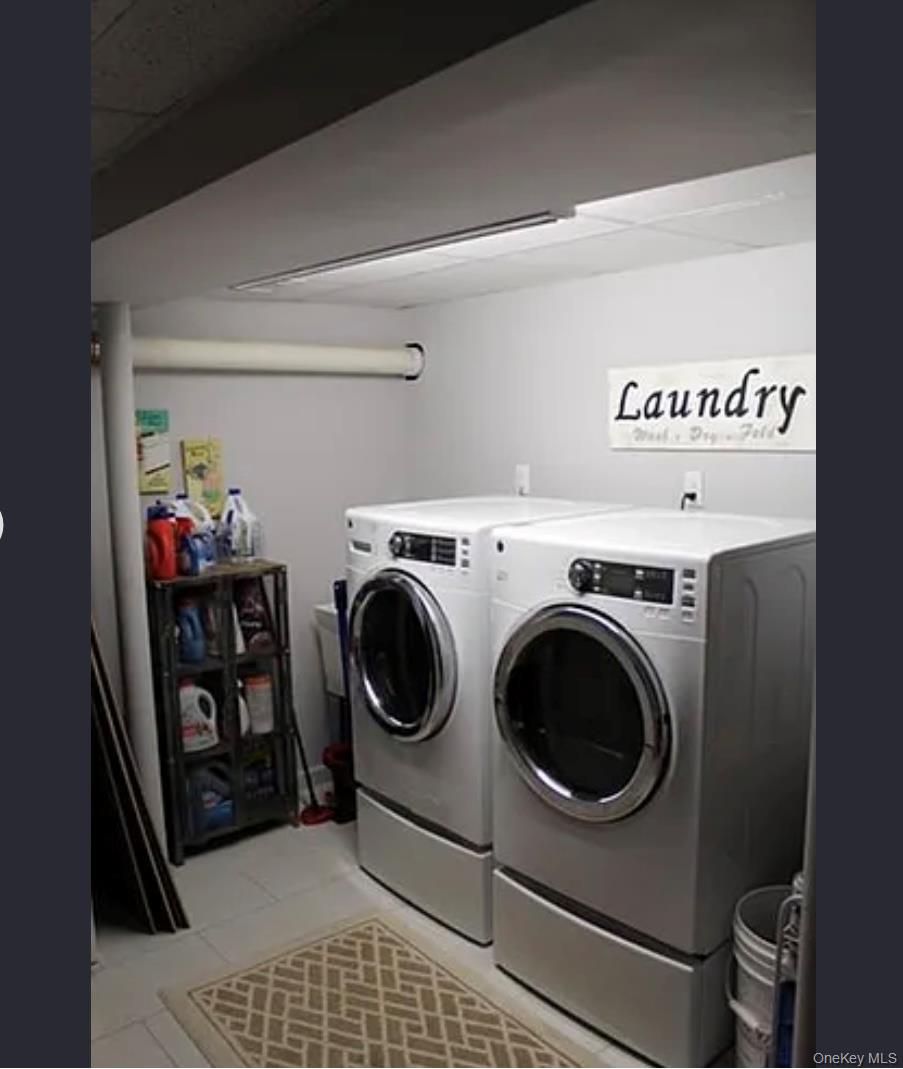 78-45 79th Place Queens, NY 11385 - Photo 13 of 36 a utility room with dryer and washer