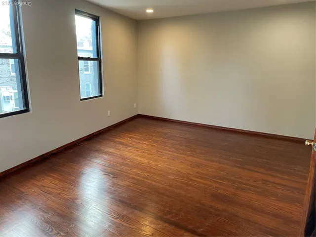 a kitchen with a sink and wooden cabinets