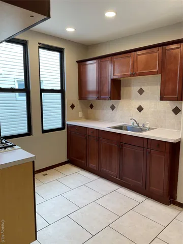 a kitchen with stainless steel appliances a refrigerator stove and microwave