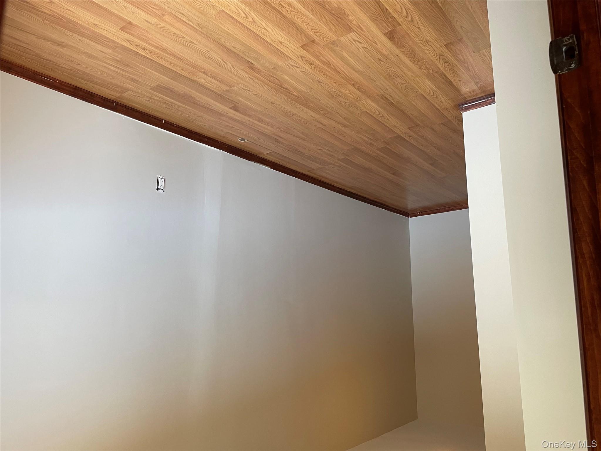 78-45 79th Place Queens, NY 11385 - Photo 24 of 36 a view of an empty room with wooden floor