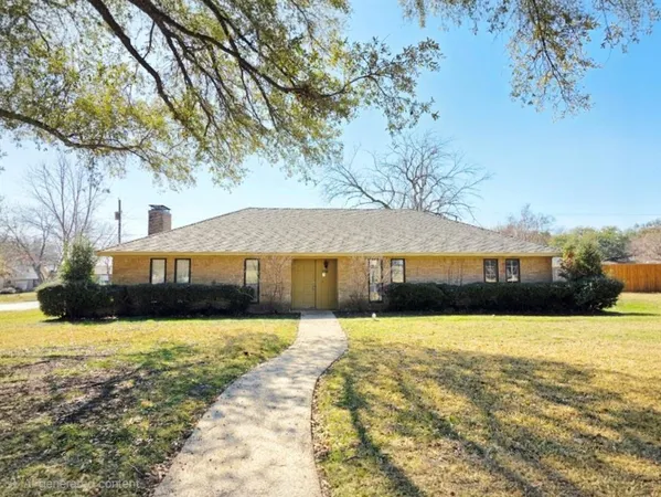 a front view of a house with swimming pool and a yard