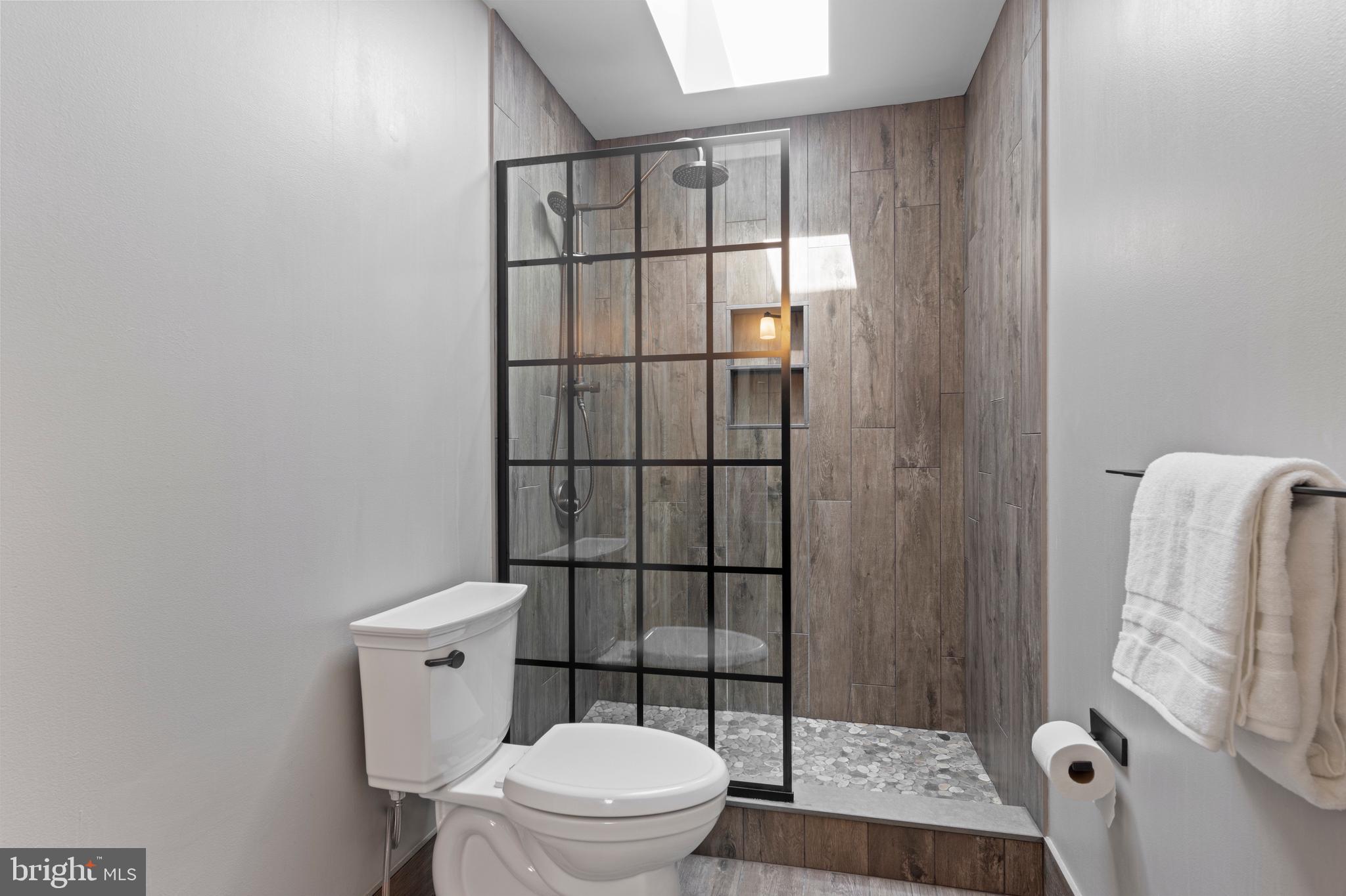 705 Turnbridge Road Wayne, PA 19087 - Photo 68 of 84 Jack and Jill shower with pebble floor