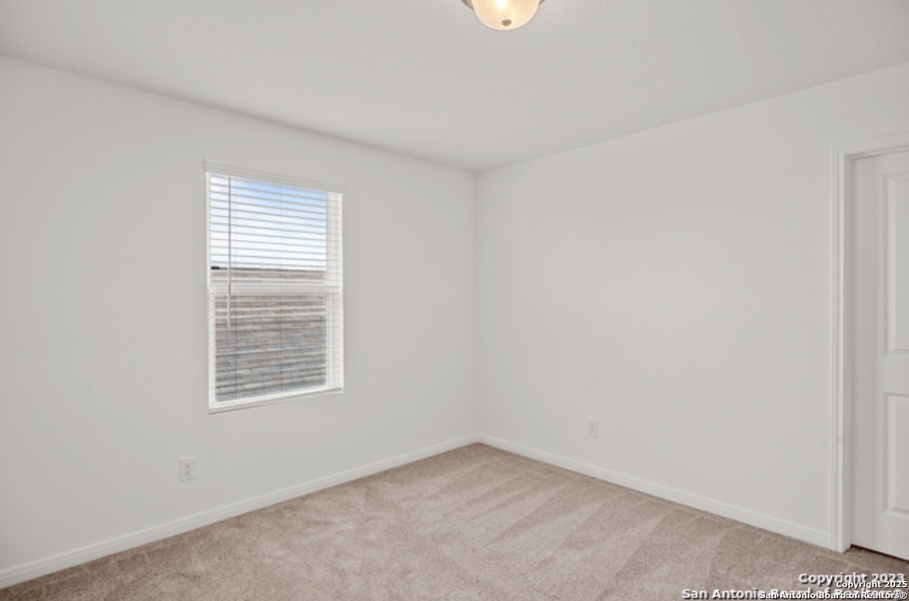 14677 Maple Terrace San Antonio, TX 78253 - Photo 6 of 13 an empty room with windows