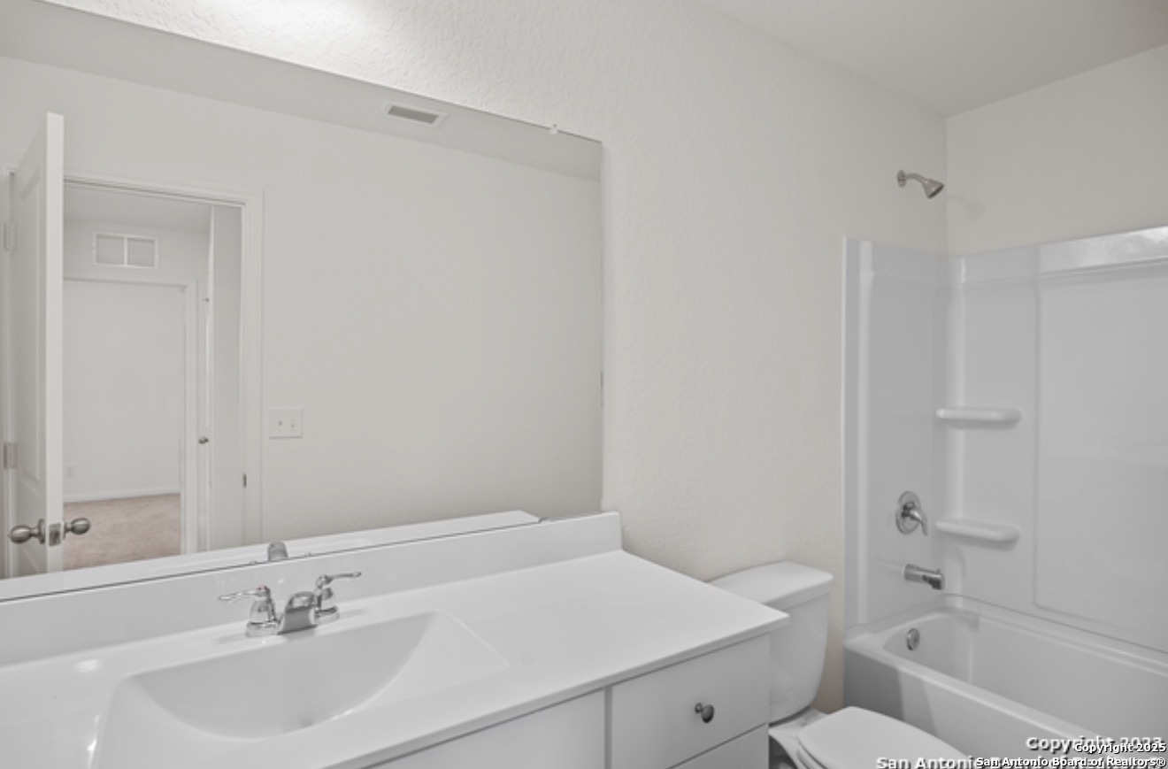 14677 Maple Terrace San Antonio, TX 78253 - Photo 7 of 13 a bathroom with a sink toilet and shower