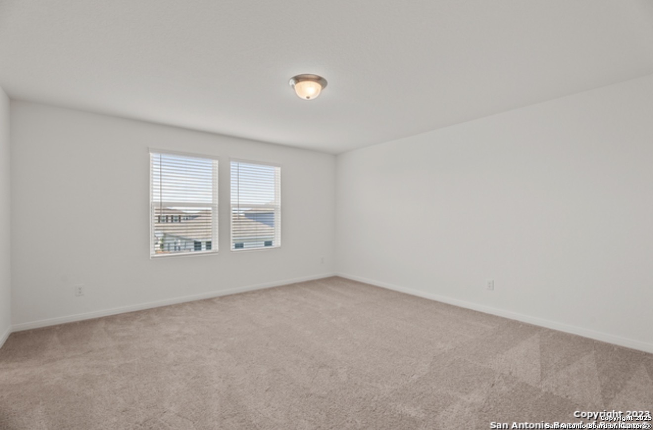 14677 Maple Terrace San Antonio, TX 78253 - Photo 9 of 13 an empty room with a window