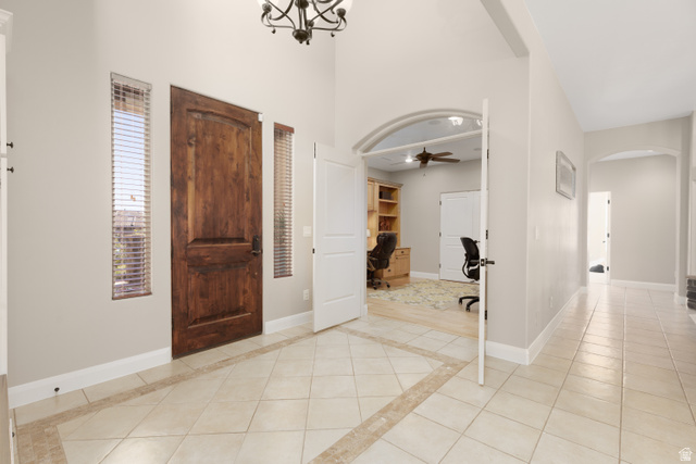 1257 West 2320 South St. George, UT 84770 - Photo 4 of 55 Grand entry featuring a distressed wood door with vertical sidelights