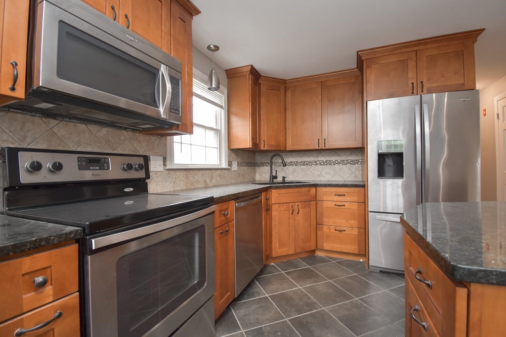 5 Northridge Road Westfield, MA 01085 - Photo 12 of 42 a kitchen with stainless steel appliances granite countertop a sink stove and refrigerator