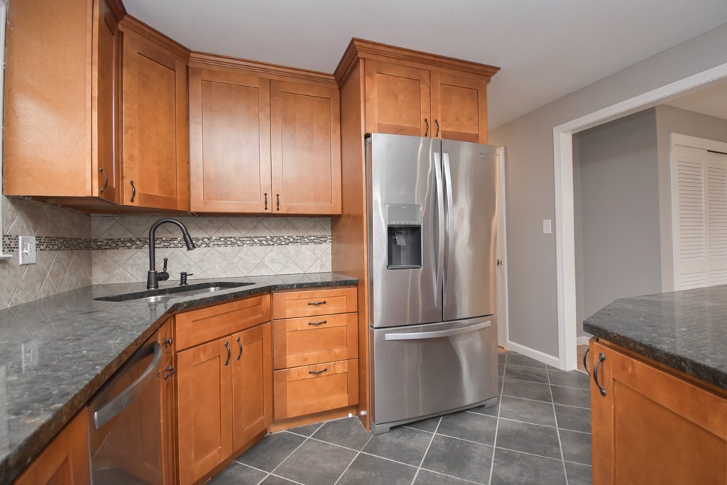5 Northridge Road Westfield, MA 01085 - Photo 13 of 42 a kitchen with stainless steel appliances granite countertop a refrigerator and a sink