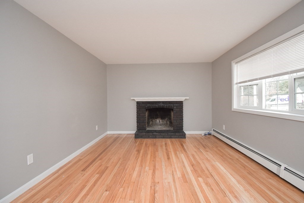 5 Northridge Road Westfield, MA 01085 - Photo 3 of 42 a view of empty room with wooden floor and fireplace
