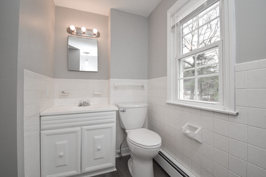 5 Northridge Road Westfield, MA 01085 - Photo 35 of 42 a bathroom with a toilet a sink a vanity a window and mirror