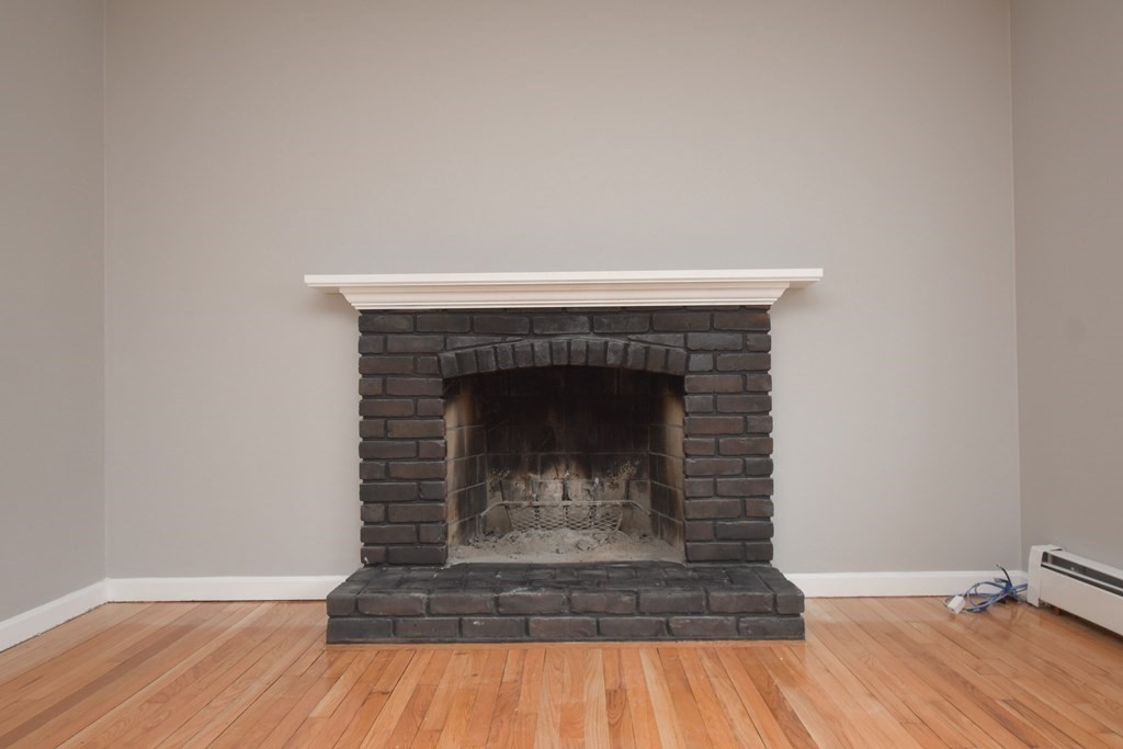 5 Northridge Road Westfield, MA 01085 - Photo 5 of 42 a room with a fireplace and wooden floor