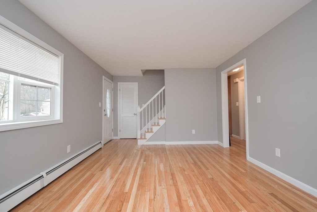 5 Northridge Road Westfield, MA 01085 - Photo 7 of 42 a view of an empty room with wooden floor and a window