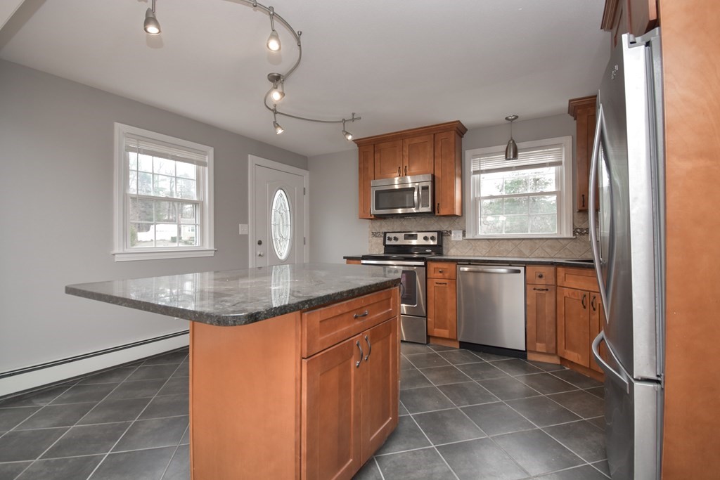 5 Northridge Road Westfield, MA 01085 - Photo 10 of 42 a kitchen with stainless steel appliances granite countertop a sink stove and refrigerator