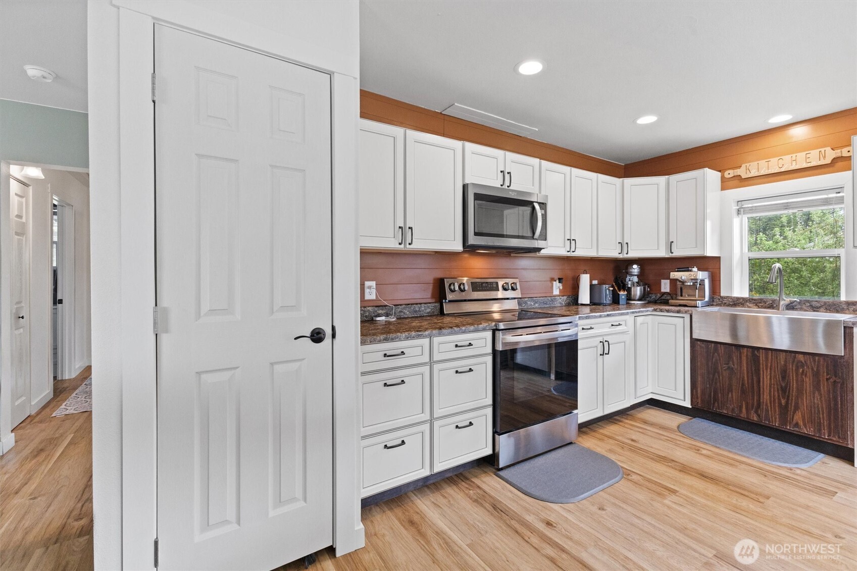 9007 Van Buren Road Everson, WA 98247 - Photo 11 of 36 a kitchen with stainless steel appliances granite countertop a stove a sink and a microwave