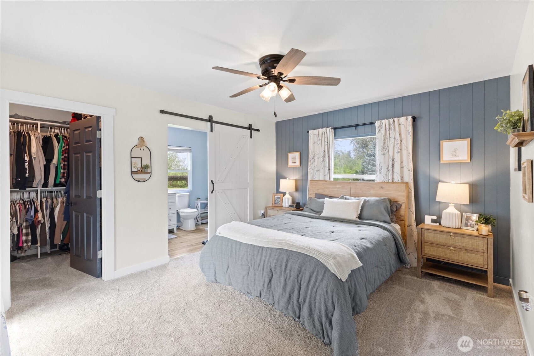 9007 Van Buren Road Everson, WA 98247 - Photo 13 of 36 a bedroom with a bed and a chandelier