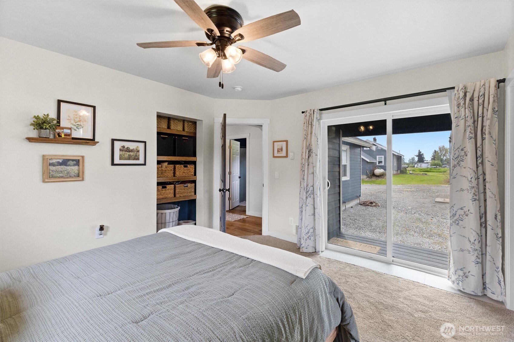 9007 Van Buren Road Everson, WA 98247 - Photo 14 of 36 a bedroom with a bed and a glass door