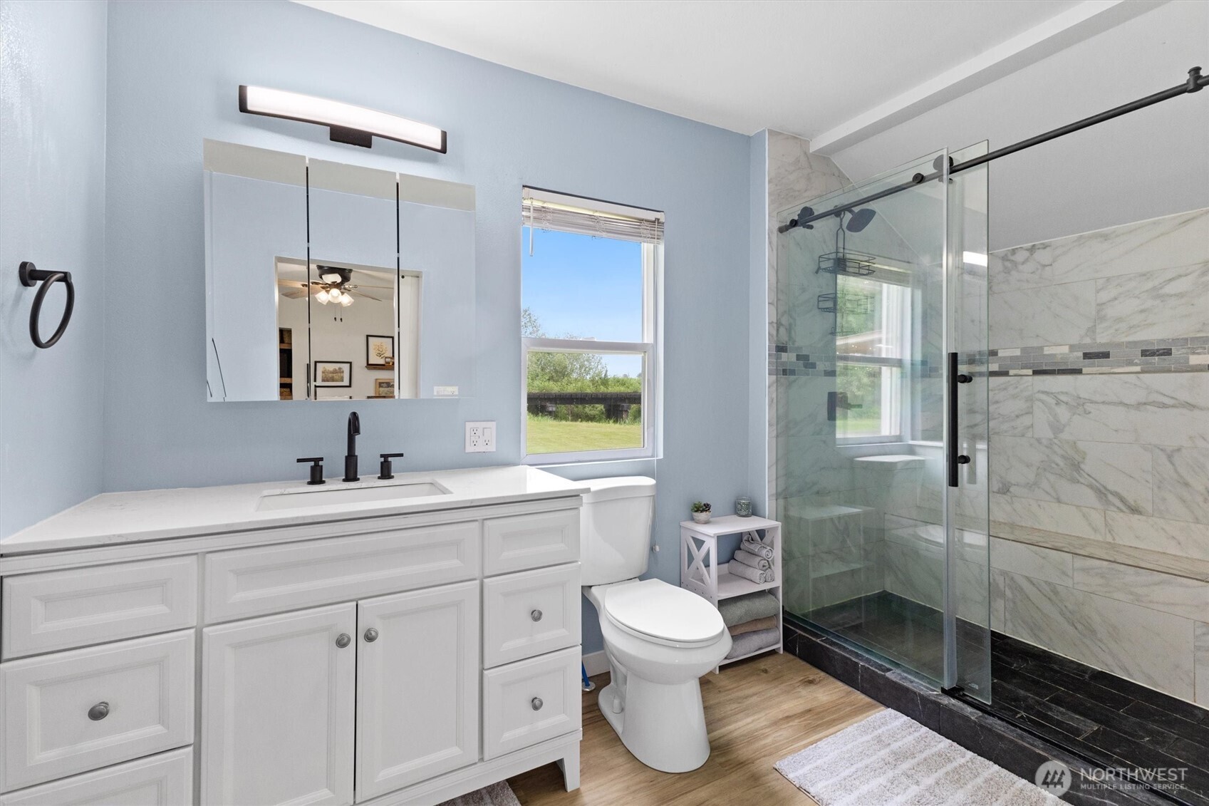 9007 Van Buren Road Everson, WA 98247 - Photo 15 of 36 a bathroom with a sink toilet and shower