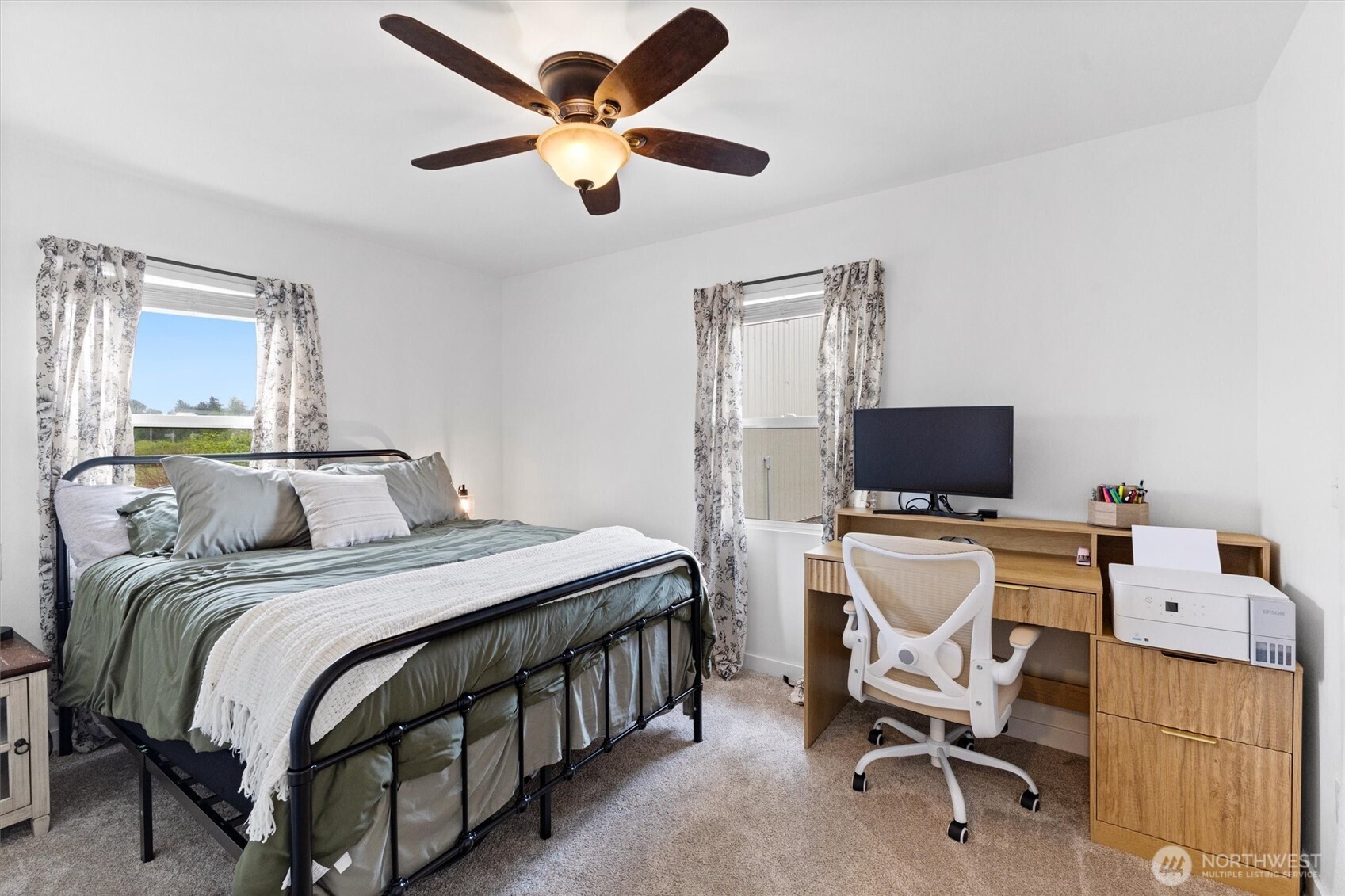 9007 Van Buren Road Everson, WA 98247 - Photo 18 of 36 a bedroom with a bed and a flat screen tv