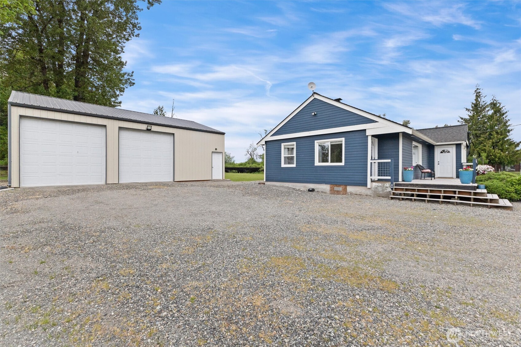 9007 Van Buren Road Everson, WA 98247 - Photo 2 of 36 a front view of house with yard and trees in the background