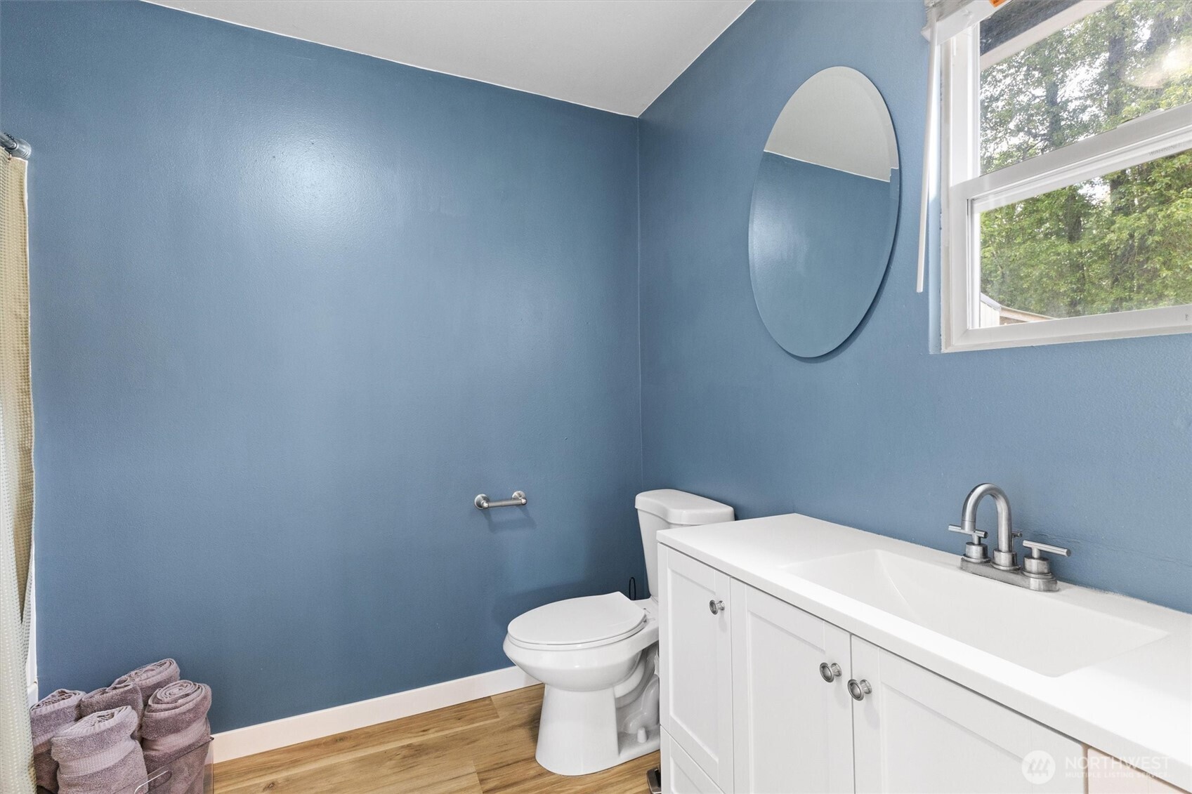 9007 Van Buren Road Everson, WA 98247 - Photo 21 of 36 a bathroom with a toilet a sink and mirror