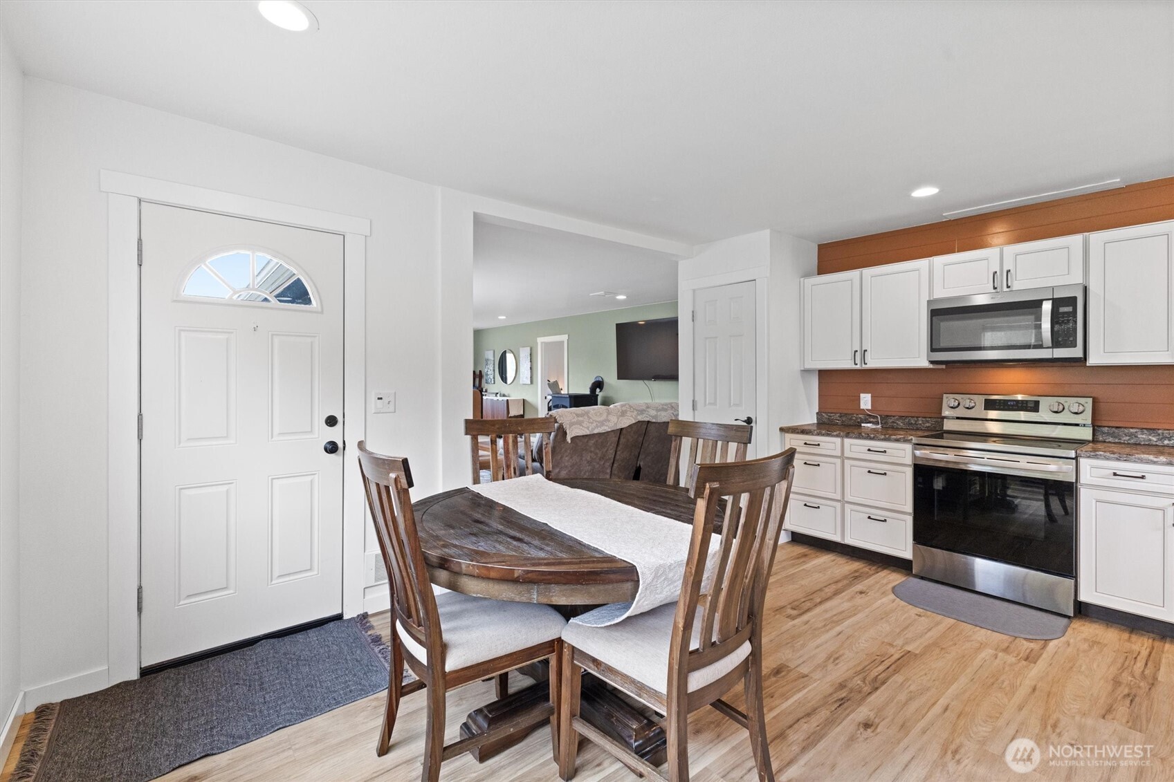 9007 Van Buren Road Everson, WA 98247 - Photo 24 of 36 a view of a dining room with furniture and wooden floor