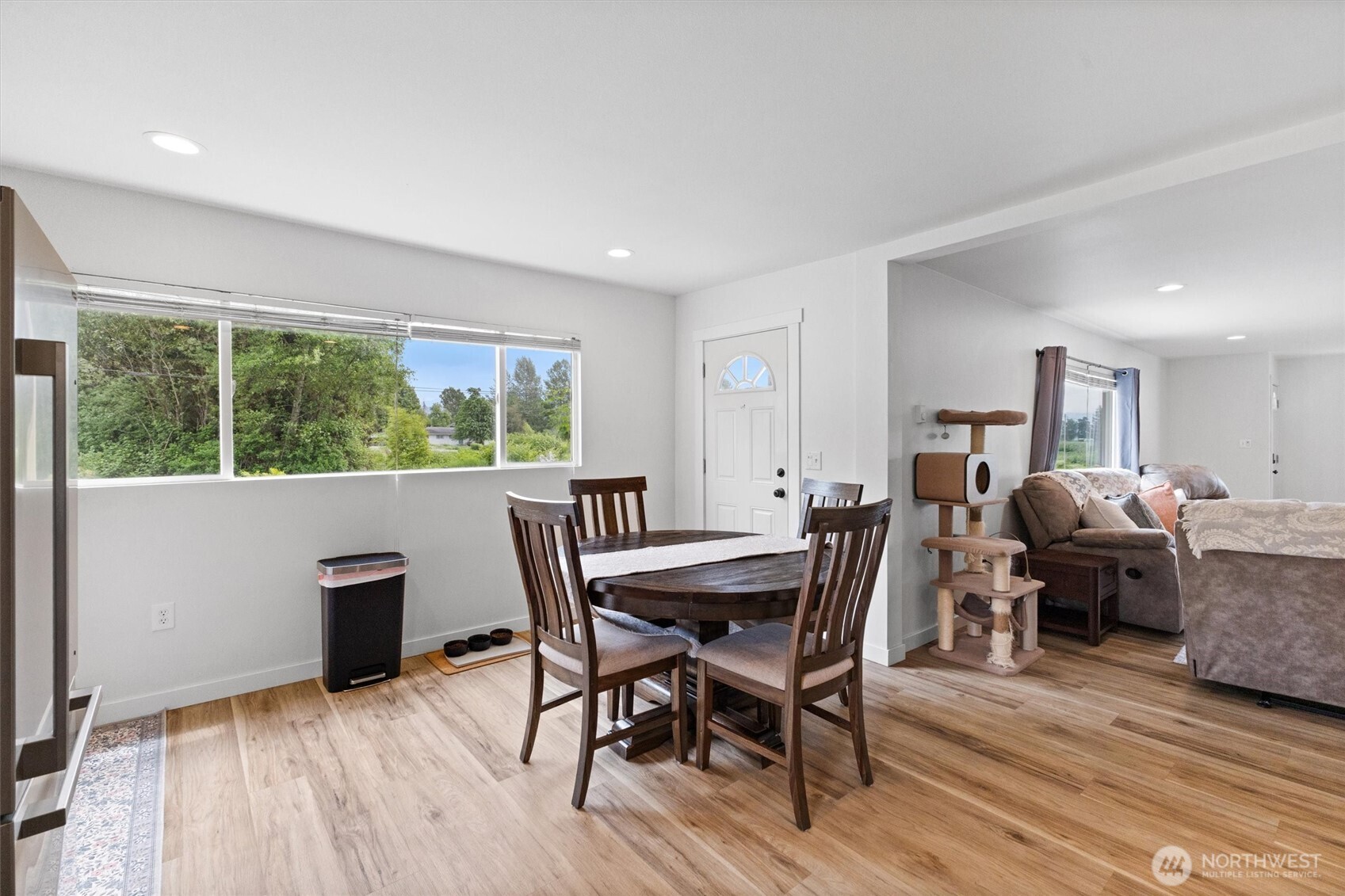 9007 Van Buren Road Everson, WA 98247 - Photo 25 of 36 a view of a dining room with furniture window and wooden floor