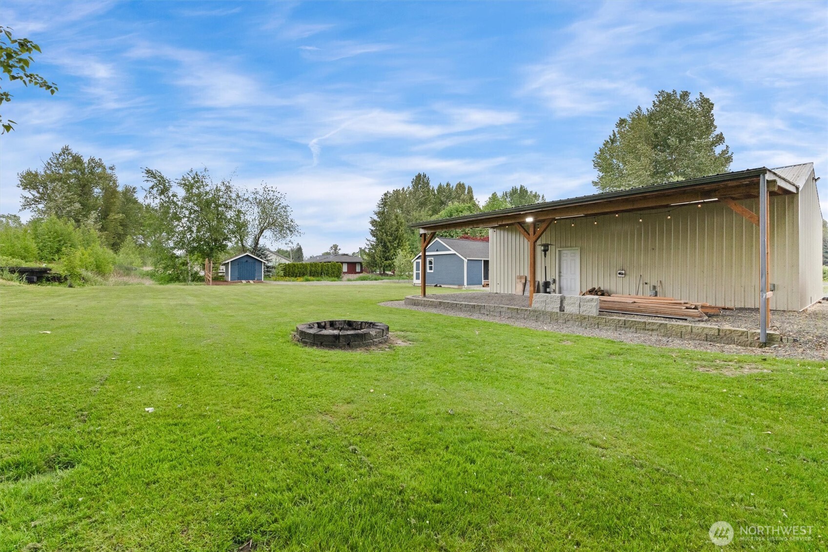9007 Van Buren Road Everson, WA 98247 - Photo 35 of 36 a front view of a house with garden and trees