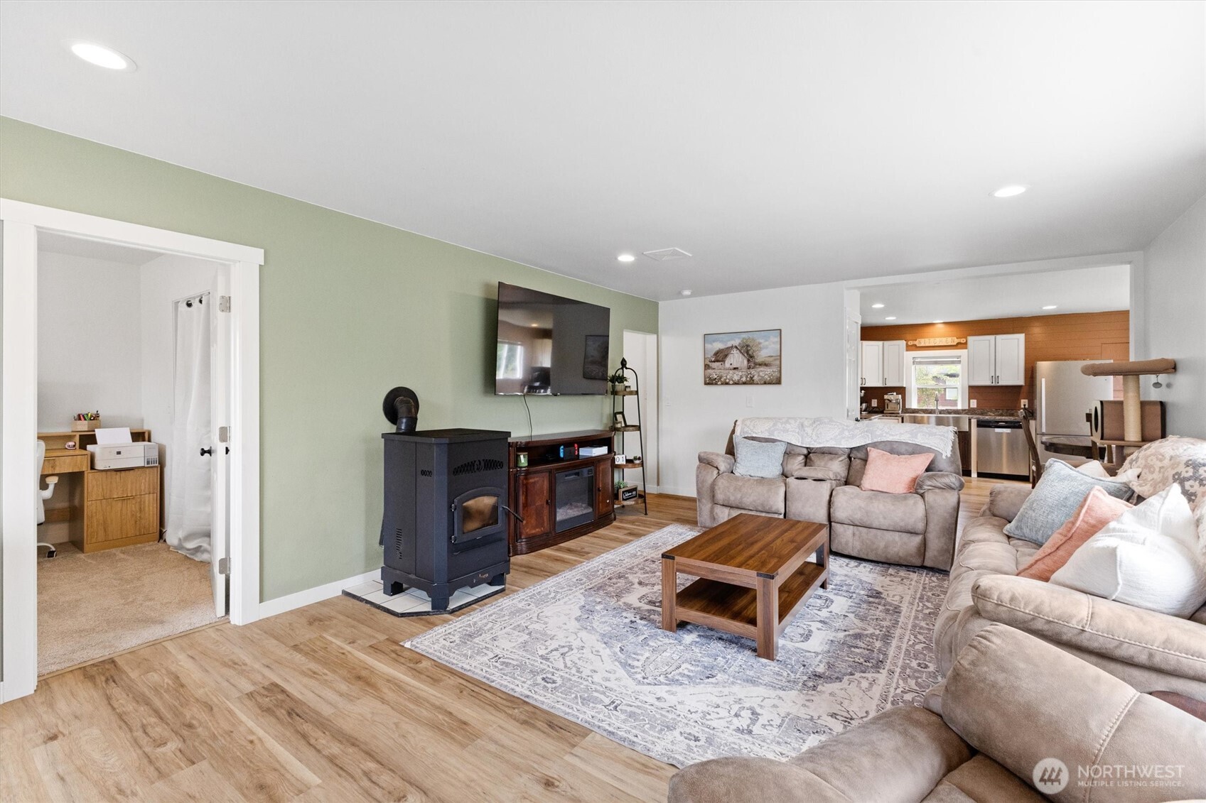 9007 Van Buren Road Everson, WA 98247 - Photo 6 of 36 a living room with furniture and a flat screen tv