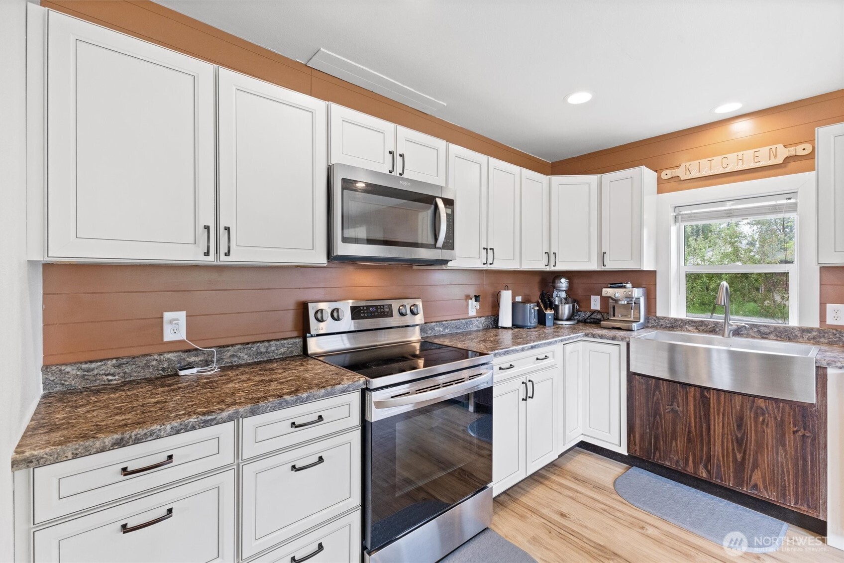 9007 Van Buren Road Everson, WA 98247 - Photo 9 of 36 a kitchen with granite countertop white cabinets white appliances a sink and a window