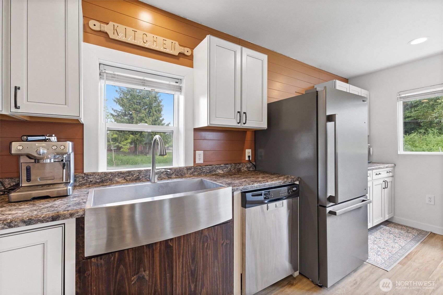 9007 Van Buren Road Everson, WA 98247 - Photo 10 of 36 a kitchen with granite countertop a refrigerator stove and sink