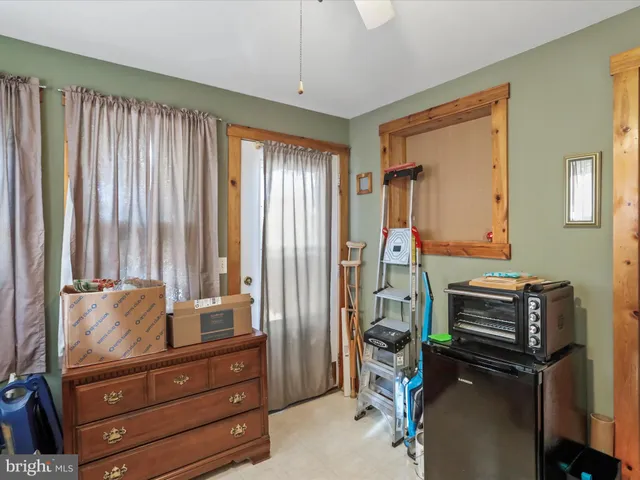 a room with furniture and large windows