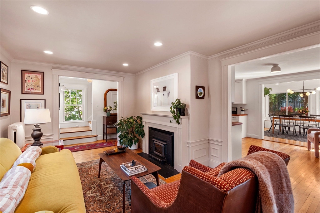 34 Avalon Road Milton, MA 02186 - Photo 10 of 42 a living room with furniture a fireplace and a large window