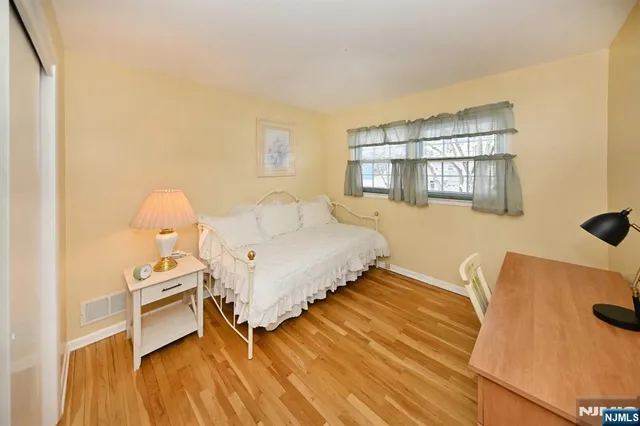 a bedroom with a bed and a cabinets