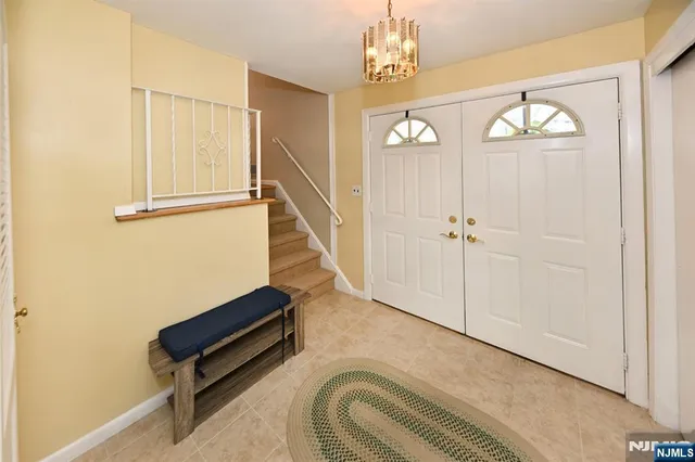 a view of a livingroom with furniture and stairs