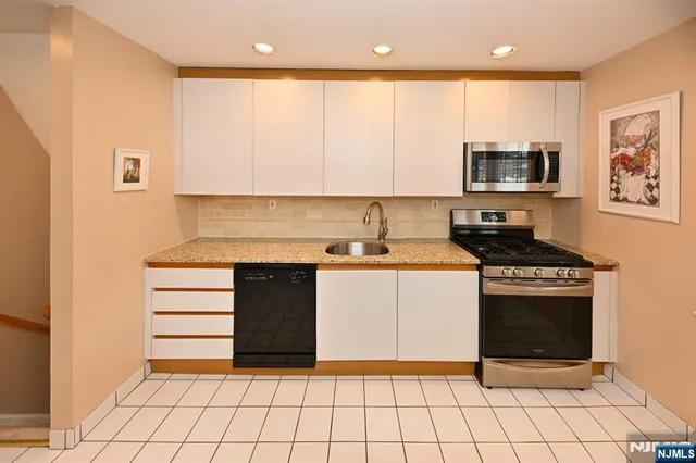 a kitchen with a stove and a refrigerator