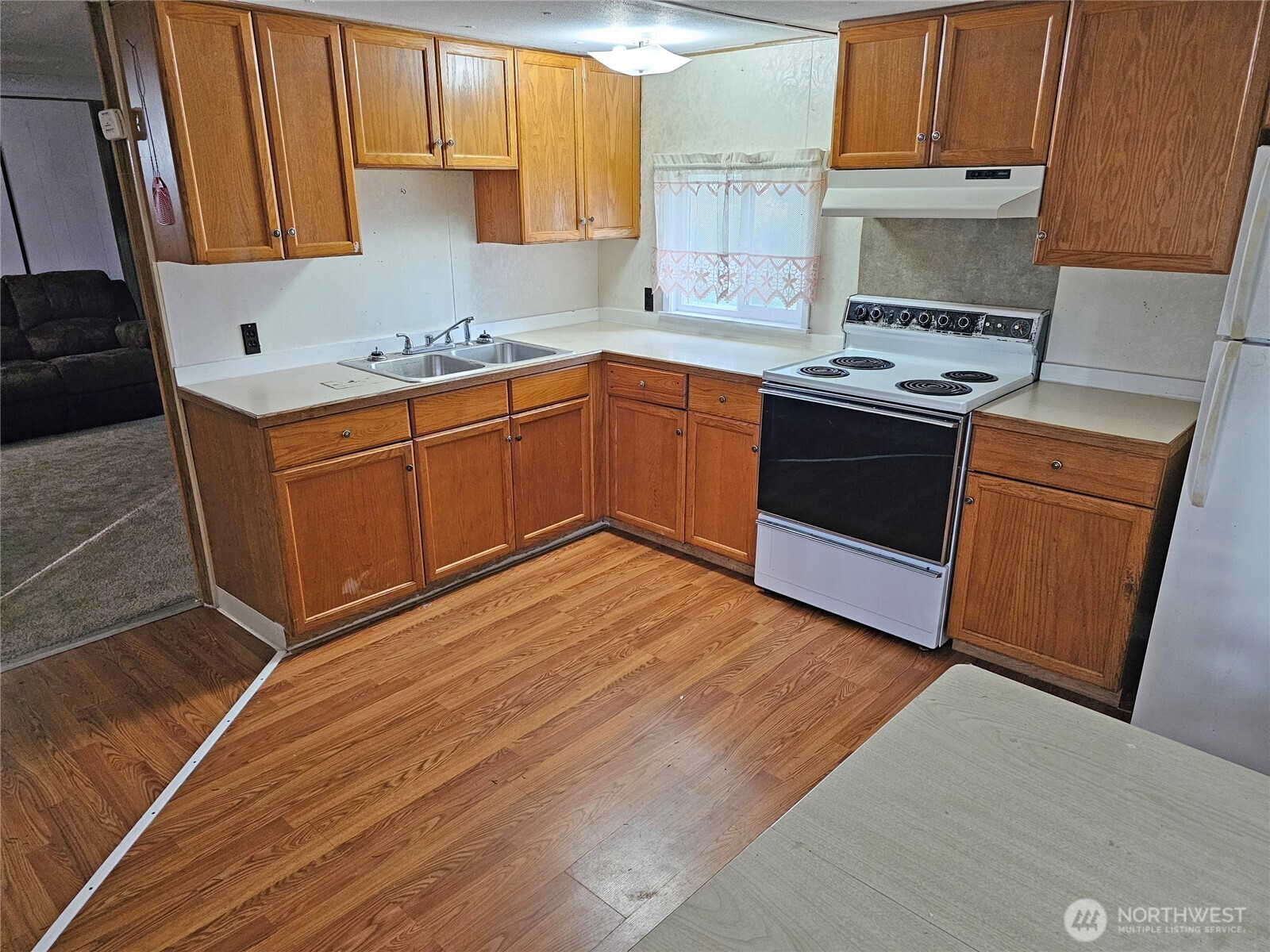 18525 Sargent Road Southwest Rochester, WA 98579 - Photo 5 of 37 a kitchen with stainless steel appliances granite countertop a sink stove and cabinets